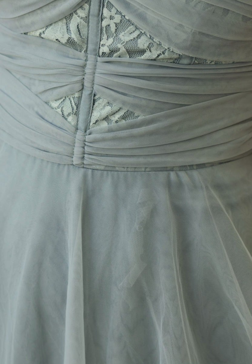 Close-up of Genevie Midi Dress showing tulle fabric, intricate lace detailing, and gathered bust design.