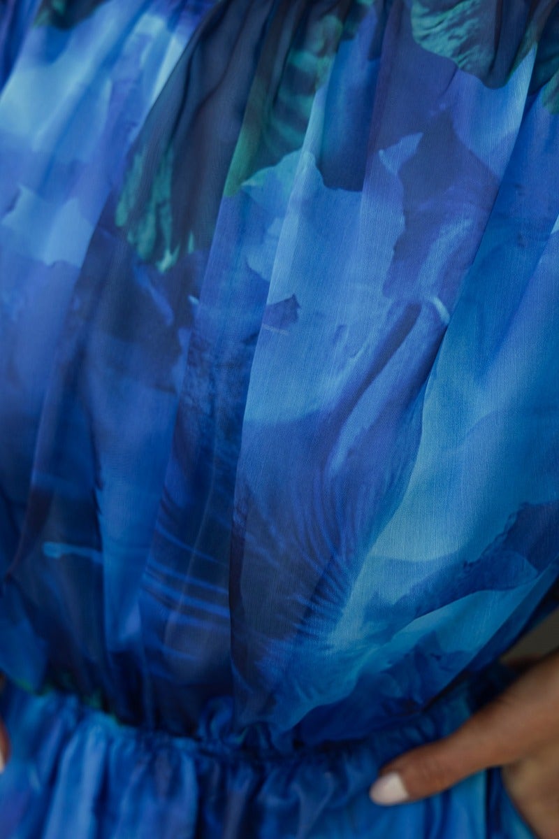 Close-up of the Our Chance Dress featuring multi-colour fabric and high neckline with tie detail.