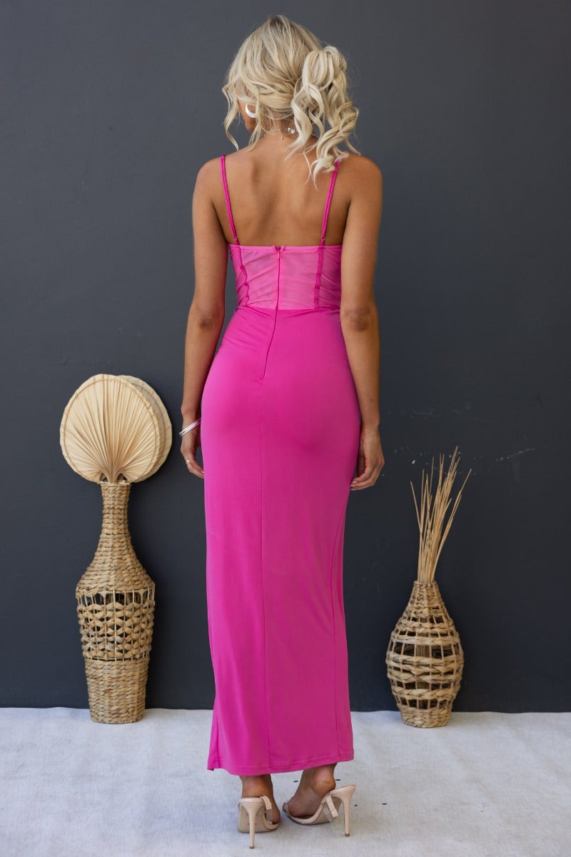 Back view of the Havilah Midi Dress in vibrant pink with padded bust and adjustable spaghetti straps.