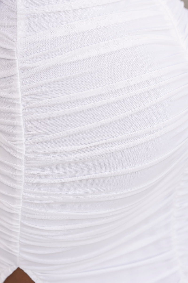 Close-up of the ruching detail on the white mesh overlay of the Gylda Midi Dress by Amaroso, showcasing its elegant texture.