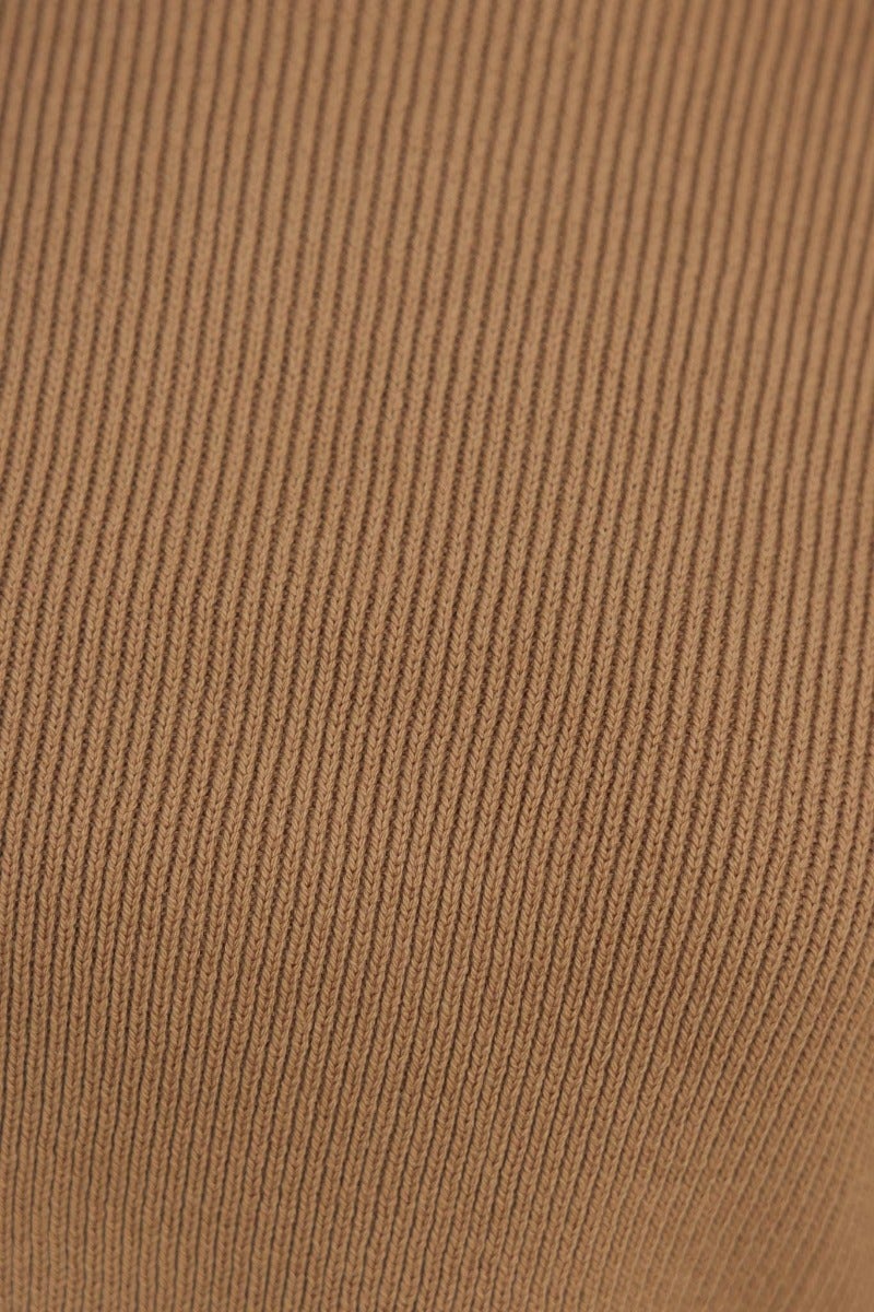 Close-up of the ribbed texture of the Her Vibe Jumper in brown, showcasing high-quality knit material.