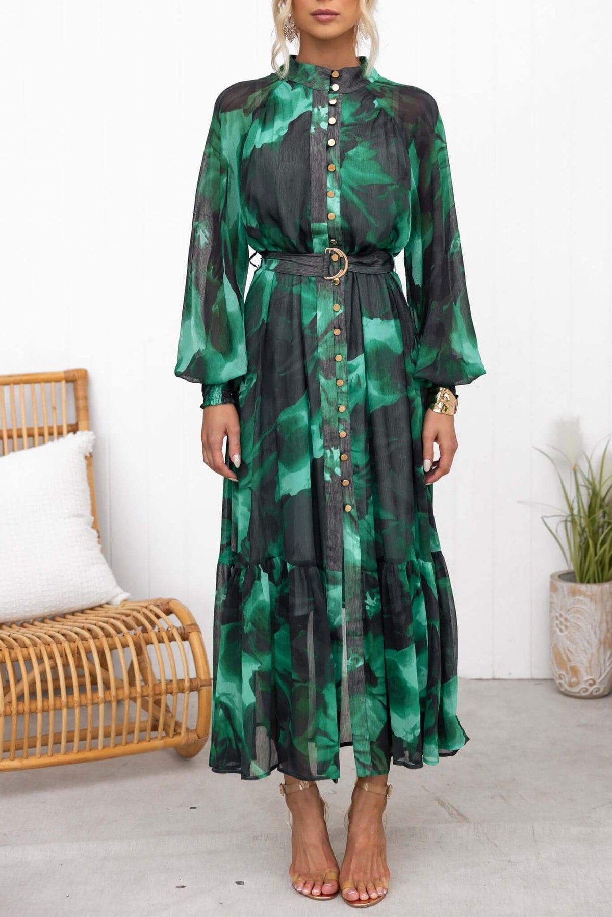 Model wearing the Orazio Maxi Dress in green chiffon with a high neckline, button-up front, and removable belt.
