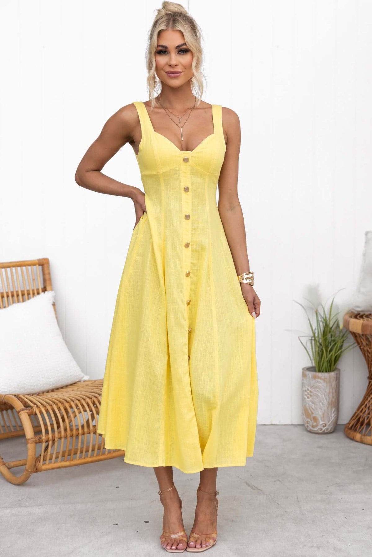 Yellow Lyre Midi Dress featuring faux buttons, elastic back, and a flowing design, perfect for summer outings.