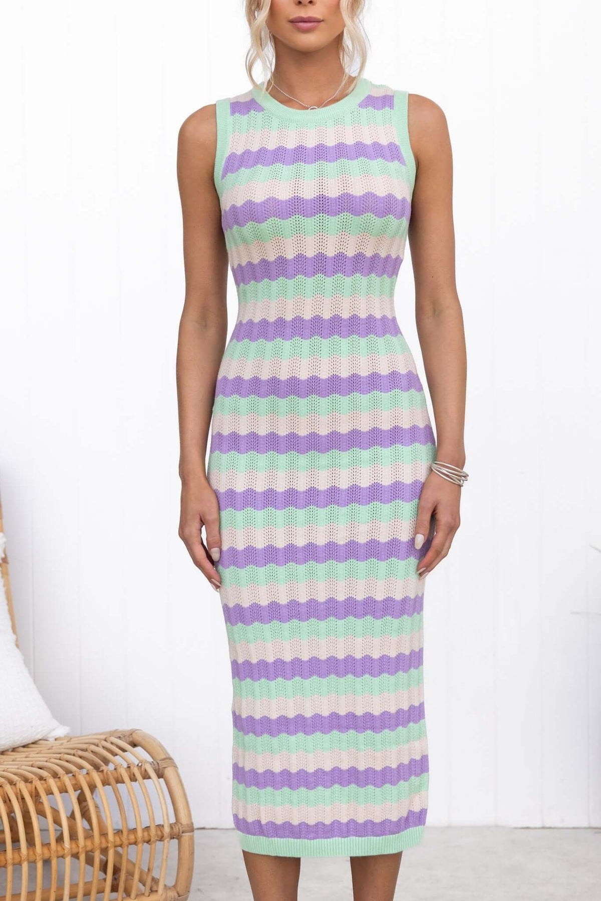 Jax Midi Dress featuring a round neckline and a stylish wavy pattern in purple and green tones.