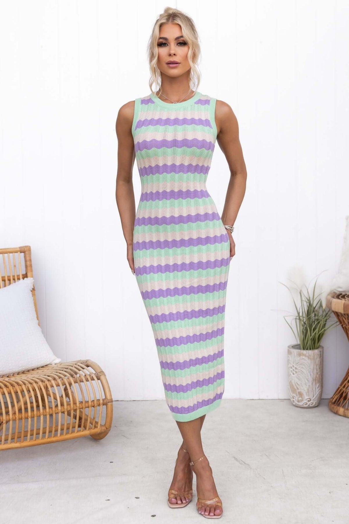 Jax Midi Dress featuring a round neckline, striped pattern in pastel colors, fitted silhouette, and stylish design.