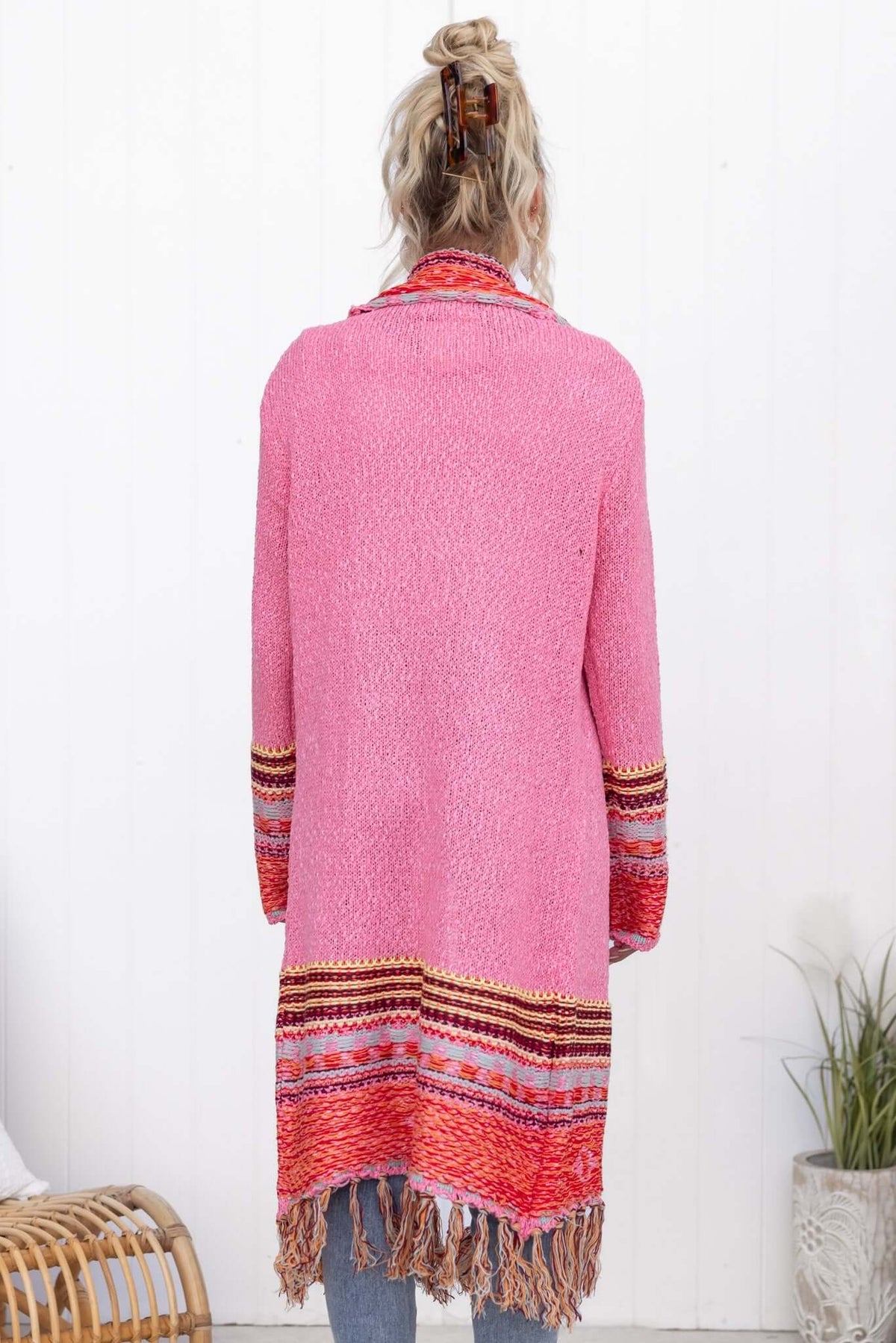 Back view of Lewis Cardigan in pink with colorful tassels, a relaxed fit, perfect for stylish layering.