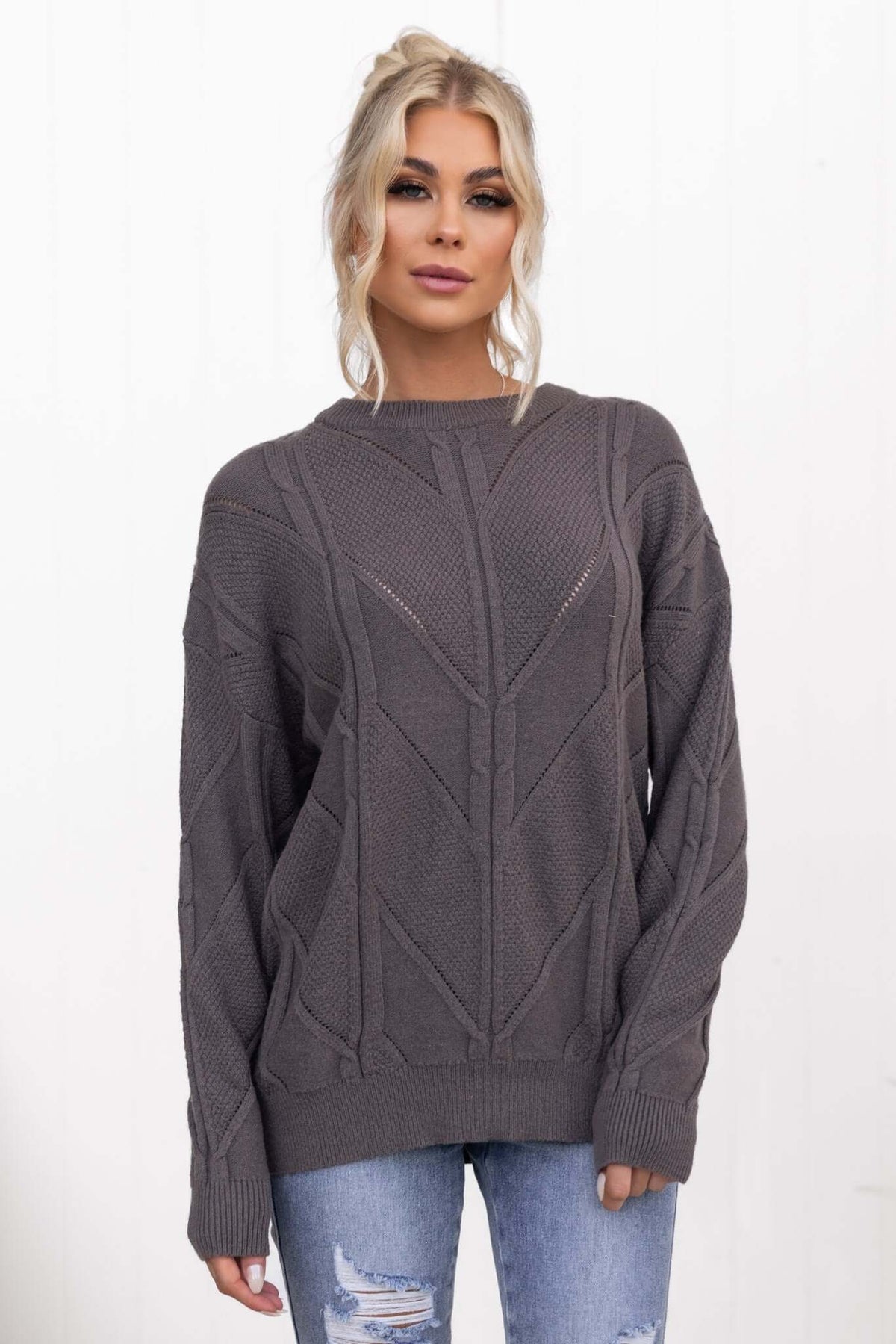 Becker Jumper in charcoal gray with a cable knit design, round neckline, and slightly relaxed fit.