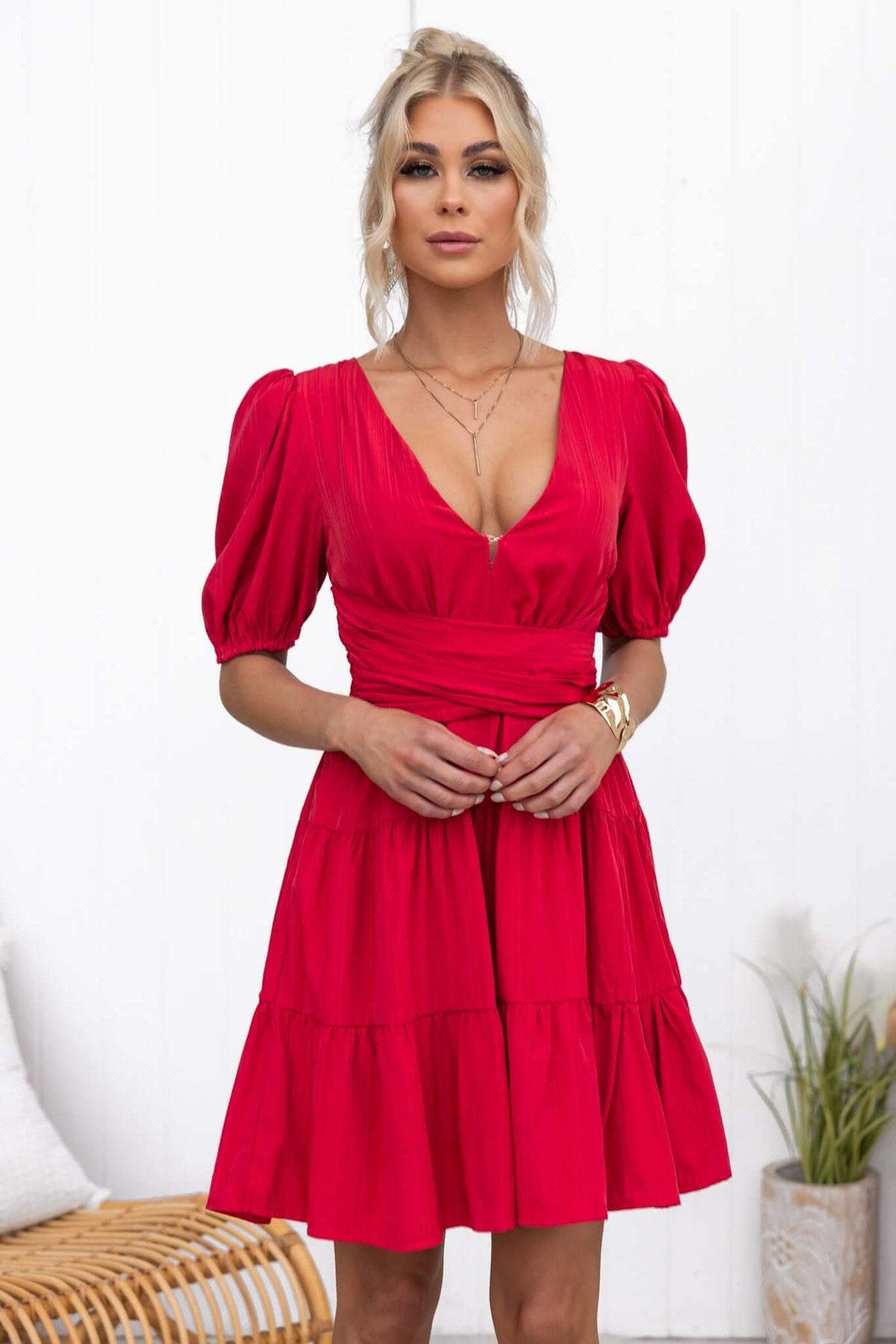 Stylish Sakura dress in vibrant red with V-neckline and puff sleeves, perfect for summer events.