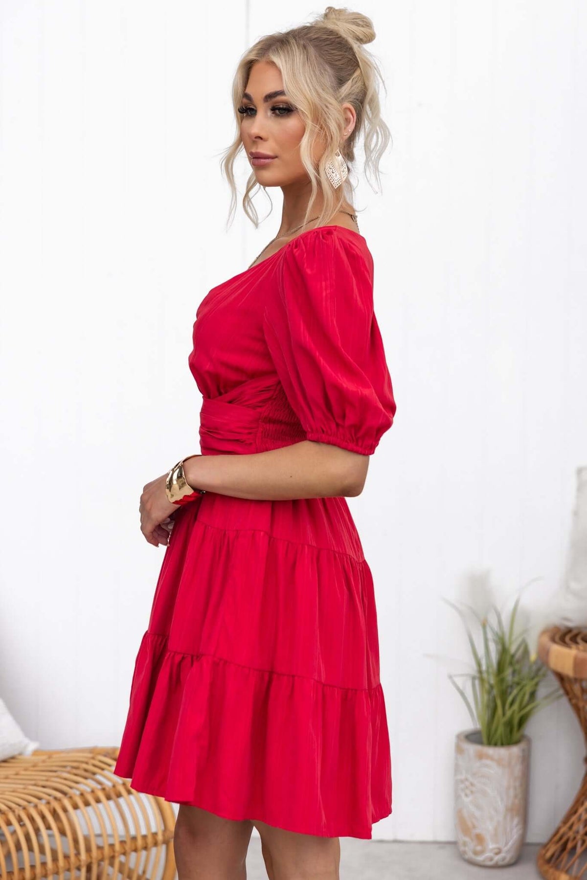 Sakura Dress: V-neckline, puff sleeves, and tiered design in vibrant red color, stylish for casual outings.