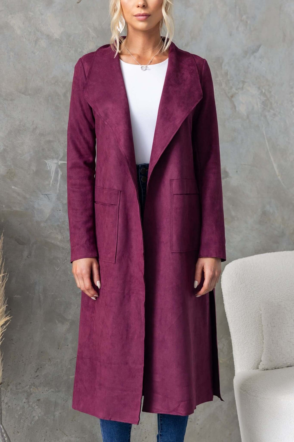 Longline Hayley Coat in burgundy with draping lapel and side pockets, styled for a chic look.