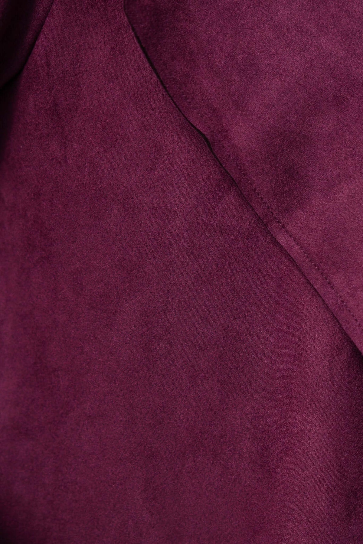 Close-up of hayley coat fabric in rich burgundy suede texture, showcasing soft material and elegant draping details.