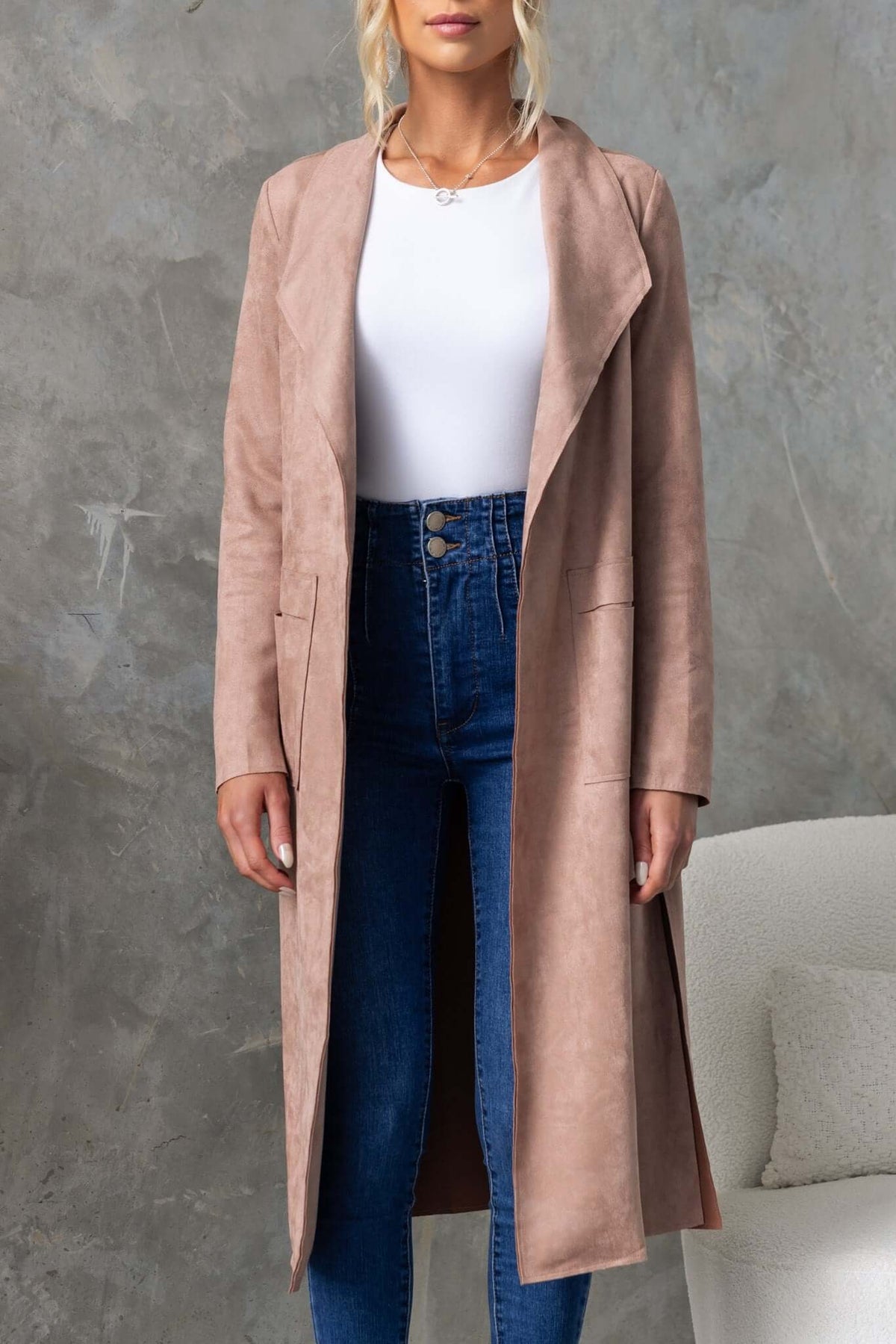 Hayley Coat in suede look, longline fit with draping lapel, paired with high-waisted jeans and a white top.