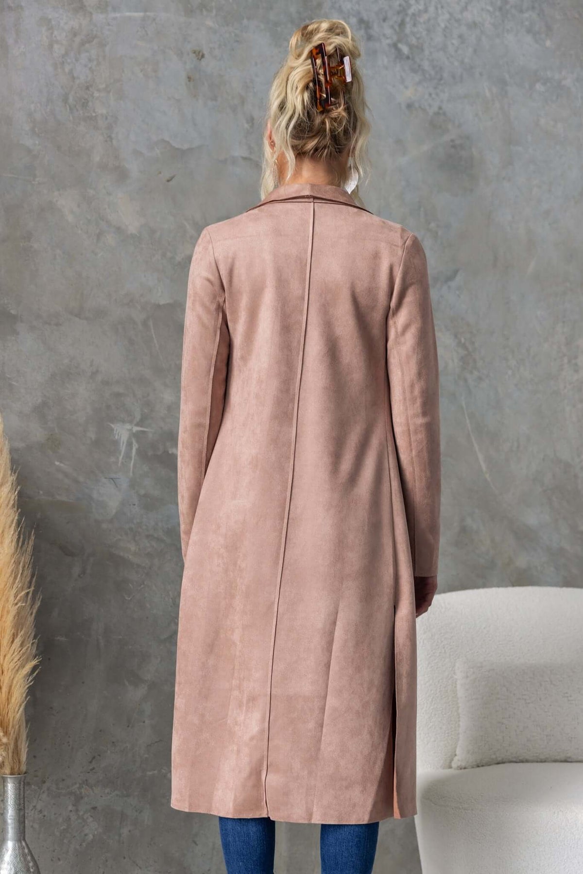 Back view of Hayley coat featuring suede look, longline fit, draping lapel, and side slits.