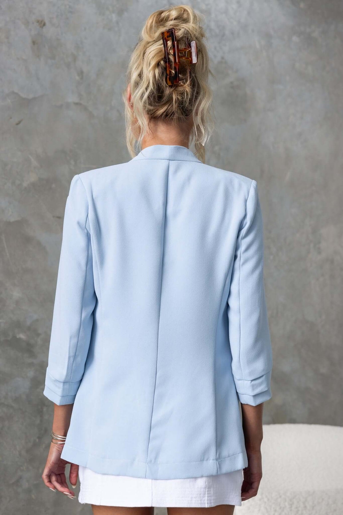 Back view of Lupton Blazer in light blue, featuring pleated sleeves and a standard fit, perfect for stylish layering.