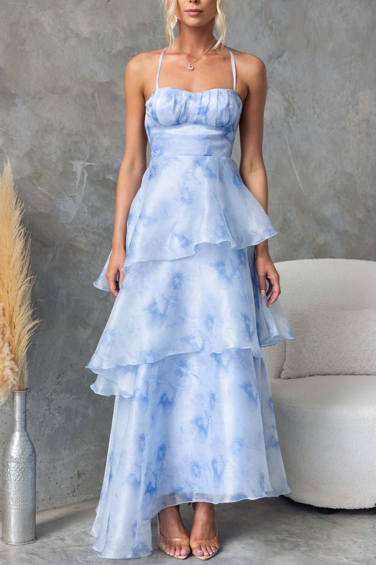 Kirsti Maxi Dress in light blue chiffon with adjustable straps and ruffle skirt, perfect for summer occasions.