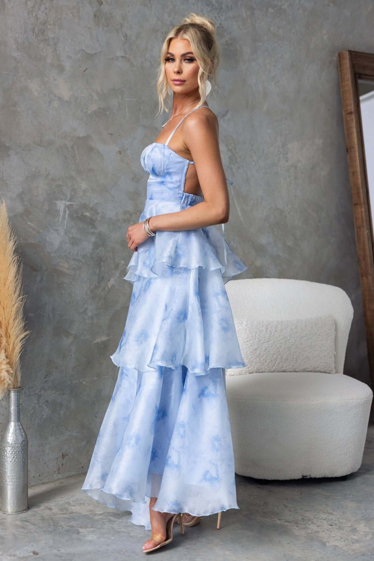 Kirsti Maxi Dress in blue chiffon with ruffle skirt, adjustable tie straps, and a stylish side zip.