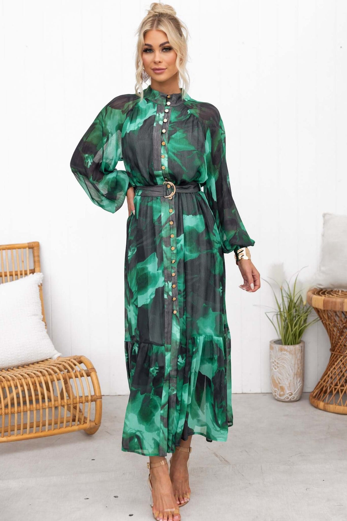 Orazio Maxi Dress featuring a high neckline, button-up front, elastic cuffs, and a removable fabric belt in a green print.
