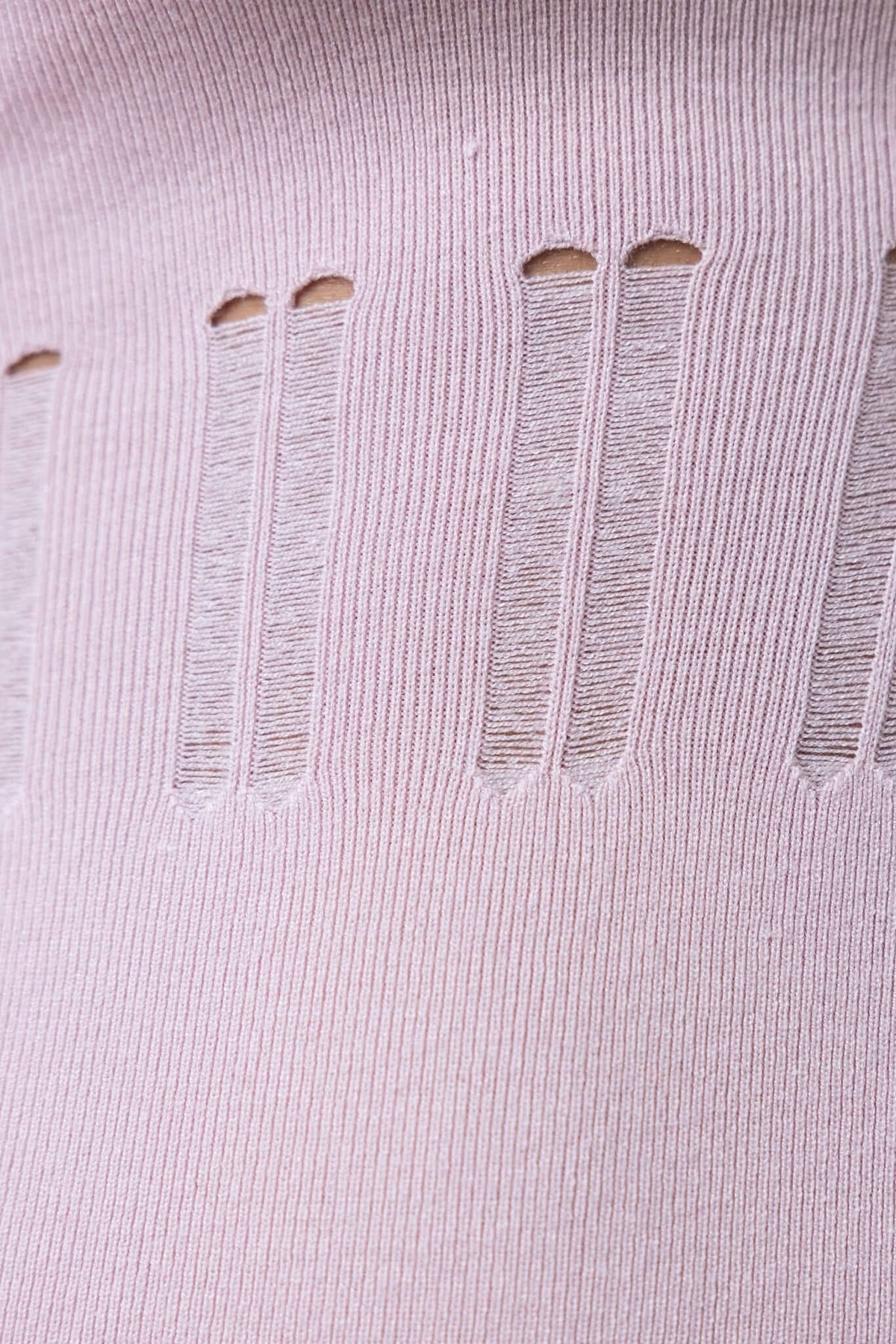 Close-up of open weave detailing on soft pink knit material of the Valery Maxi Dress.