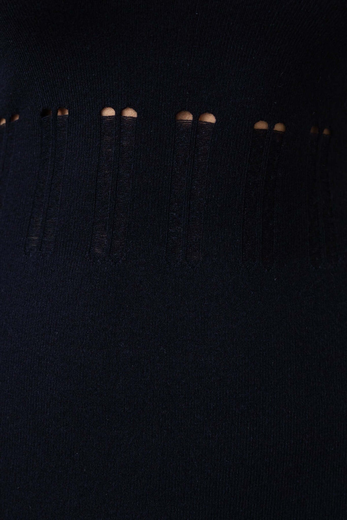 Close-up of the open weave detailing on the black Valery Maxi Dress, showcasing its stylish knit material.