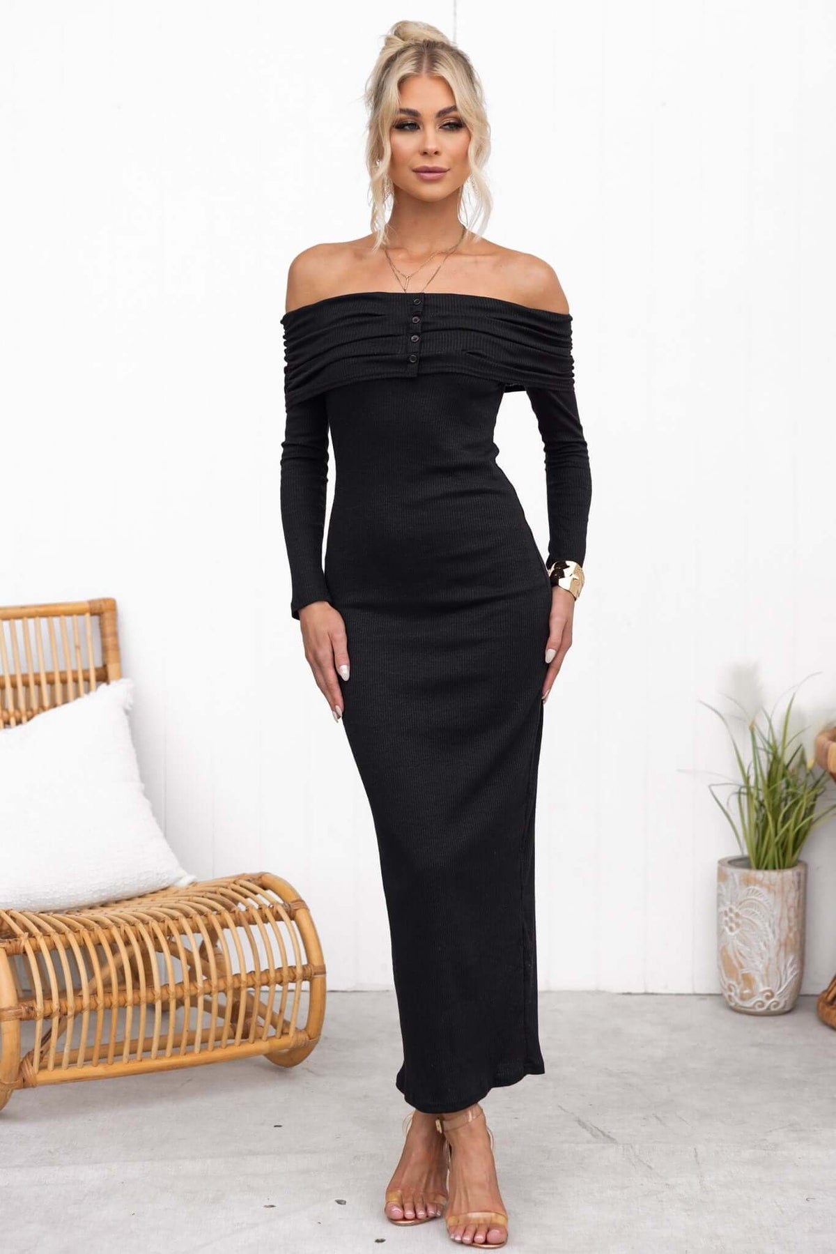 Black off-shoulder maxi dress with faux buttons, ribbed material, and a stylish fit, perfect for casual or formal occasions.