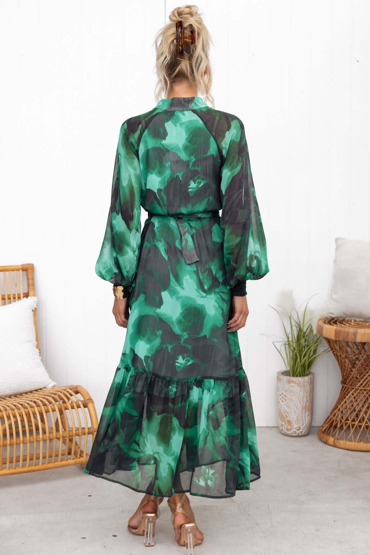 Back view of Orazio Maxi Dress in green floral chiffon with elastic cuffs and removable belt, showcasing relaxed fit.