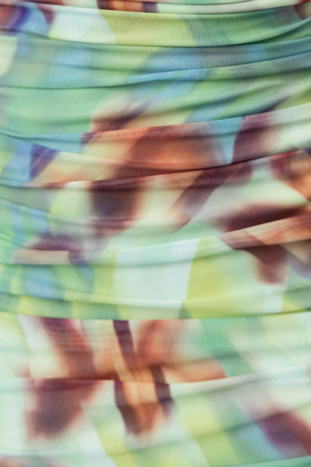 Close-up of Comiso Maxi Dress showing colorful ruching details in mesh fabric, perfect for a stylish, elegant look.