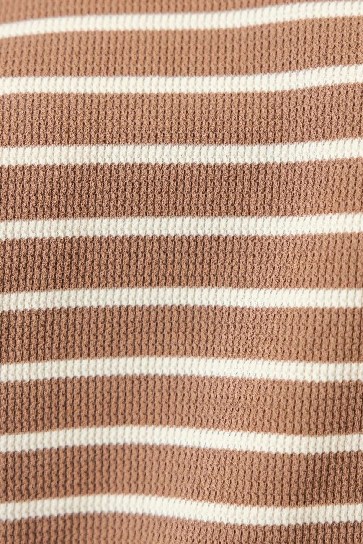 Textured fabric close-up of the East Coast Jumper featuring brown and white stripes.