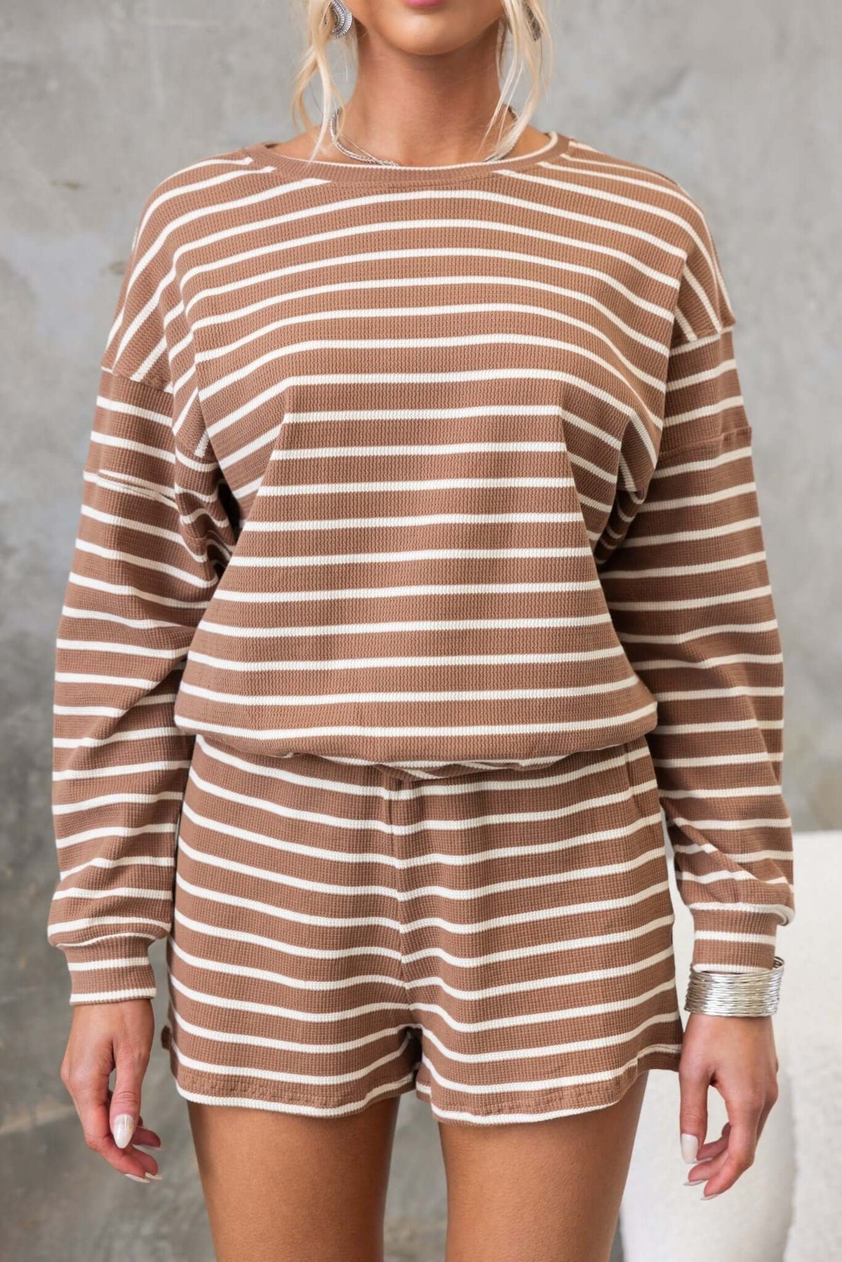 Brown striped jumper and shorts set, featuring a relaxed fit and round neckline, perfect for casual wear.