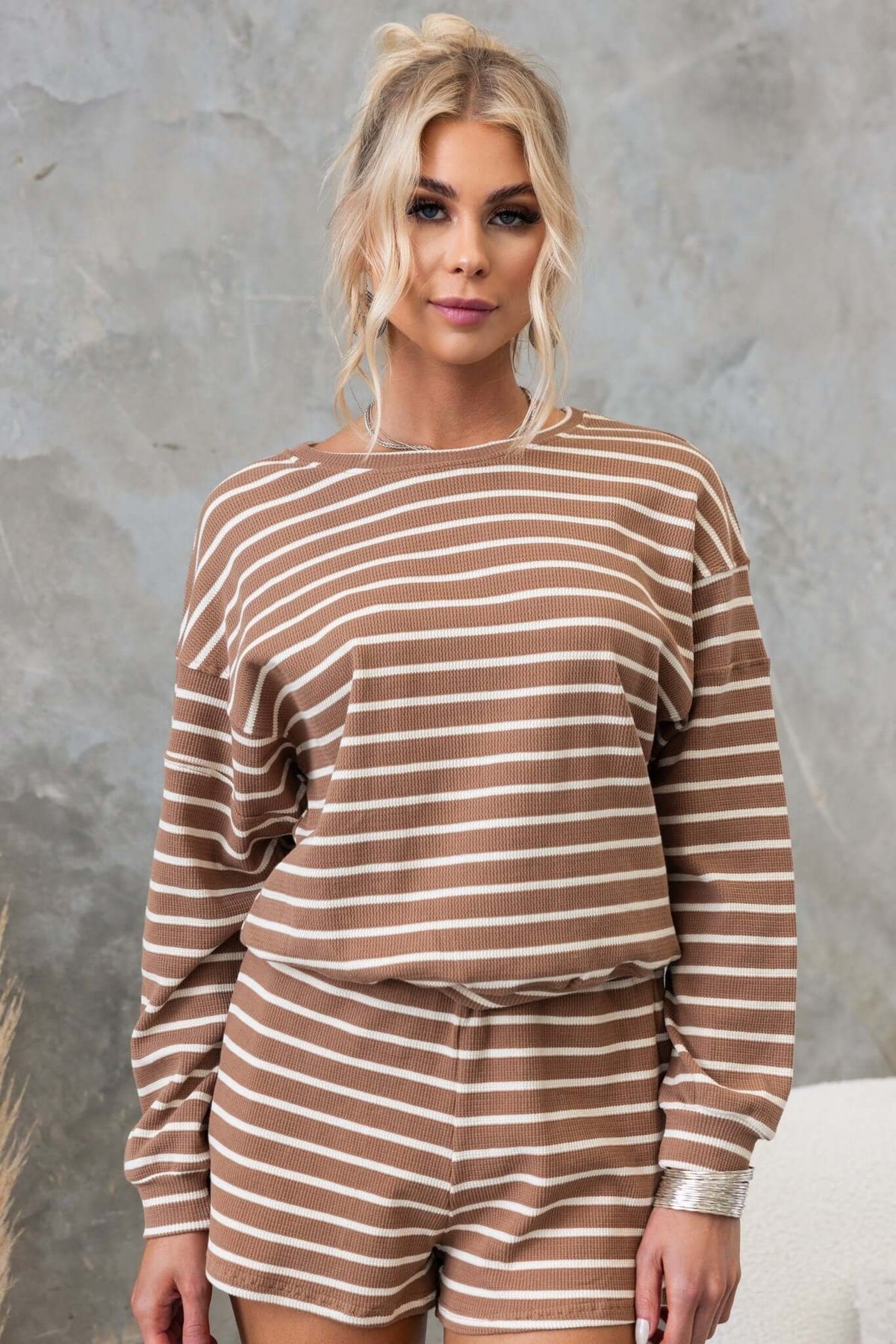 East Coast Jumper in brown and cream stripes, showcasing relaxed fit and textured cotton material.