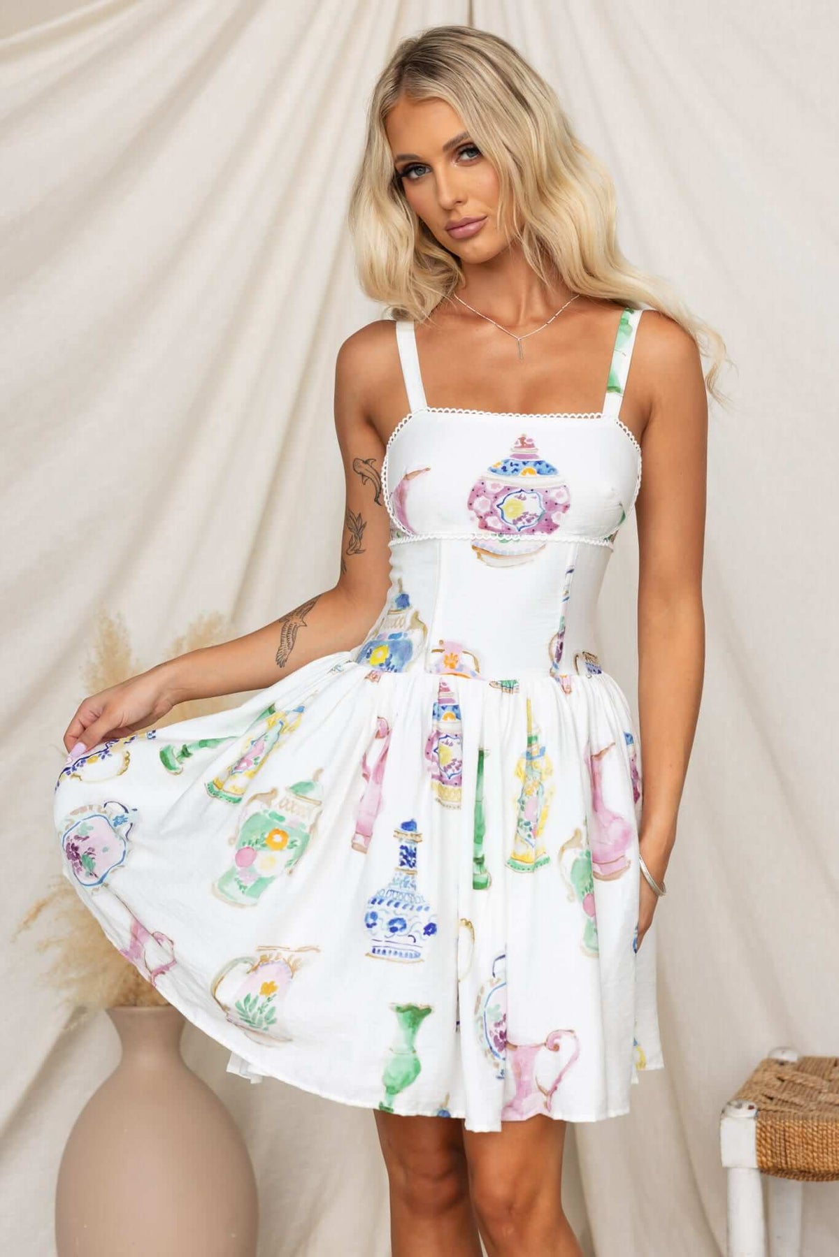 Care Free Dress featuring adjustable straps, boning, and colorful print, perfect for a stylish summer look.