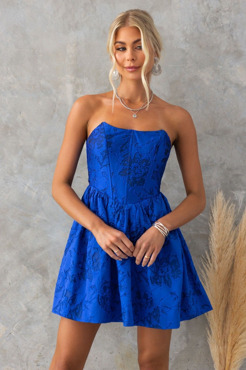 Stole My Heart Dress in vibrant blue with embossed print, strapless design, and flared skirt, perfect for stylish outings.