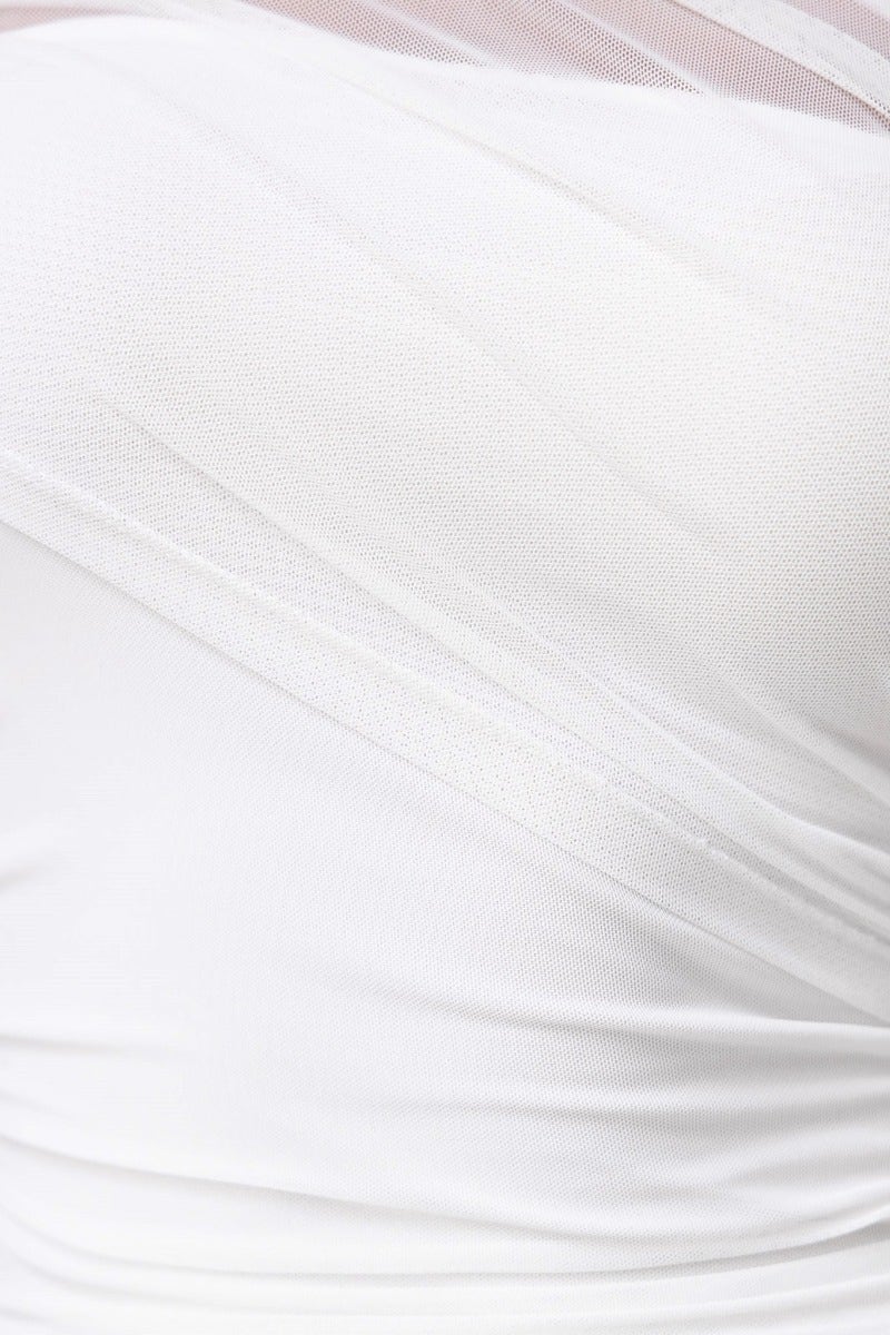 Close-up of the fabric texture and design of the Feel My Spark Maxi Dress, featuring a one-shoulder neckline and mesh overlay.