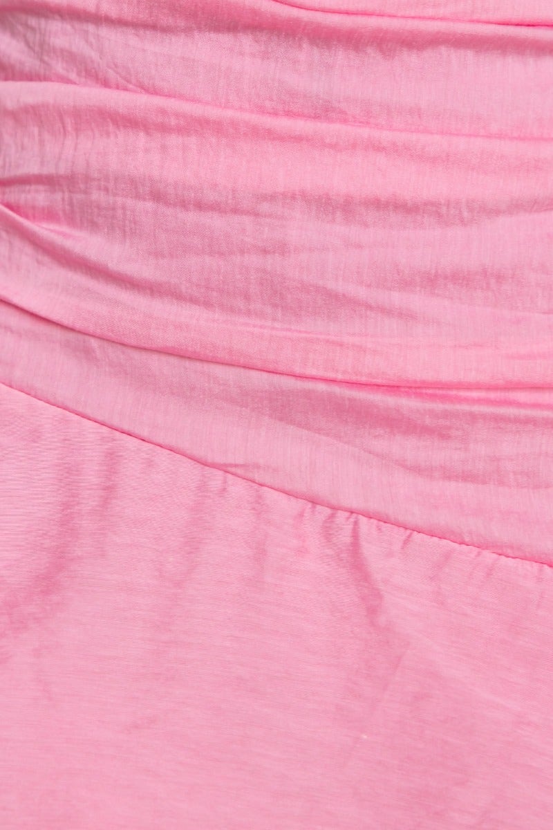 Close-up of the soft linen blend fabric of a pink Sherbert Midi Dress, showcasing ruffle hem and elegant style.