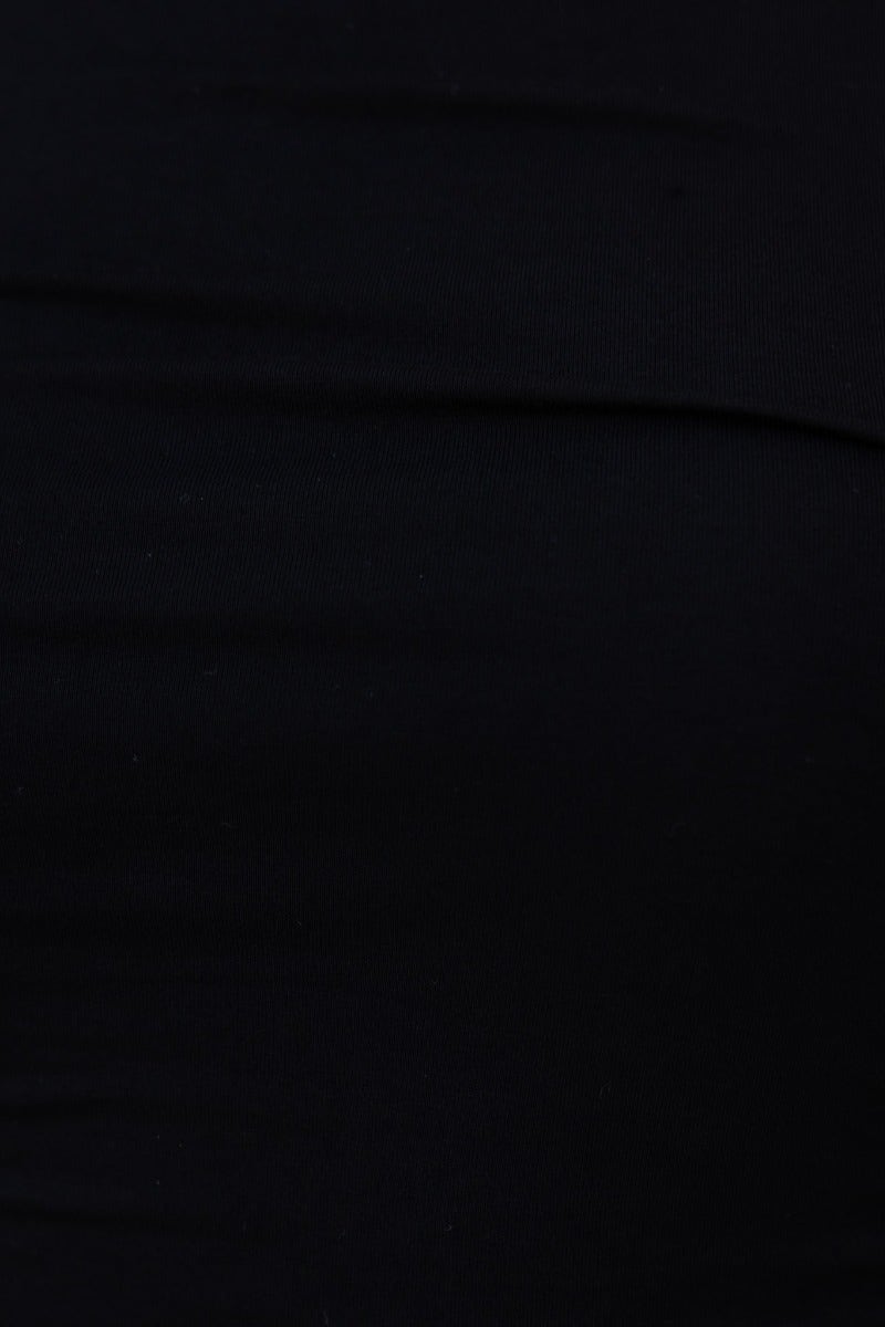 Close-up of black bodysuit fabric showing soft cotton feel and ruching details, emphasizing stretch and comfort.