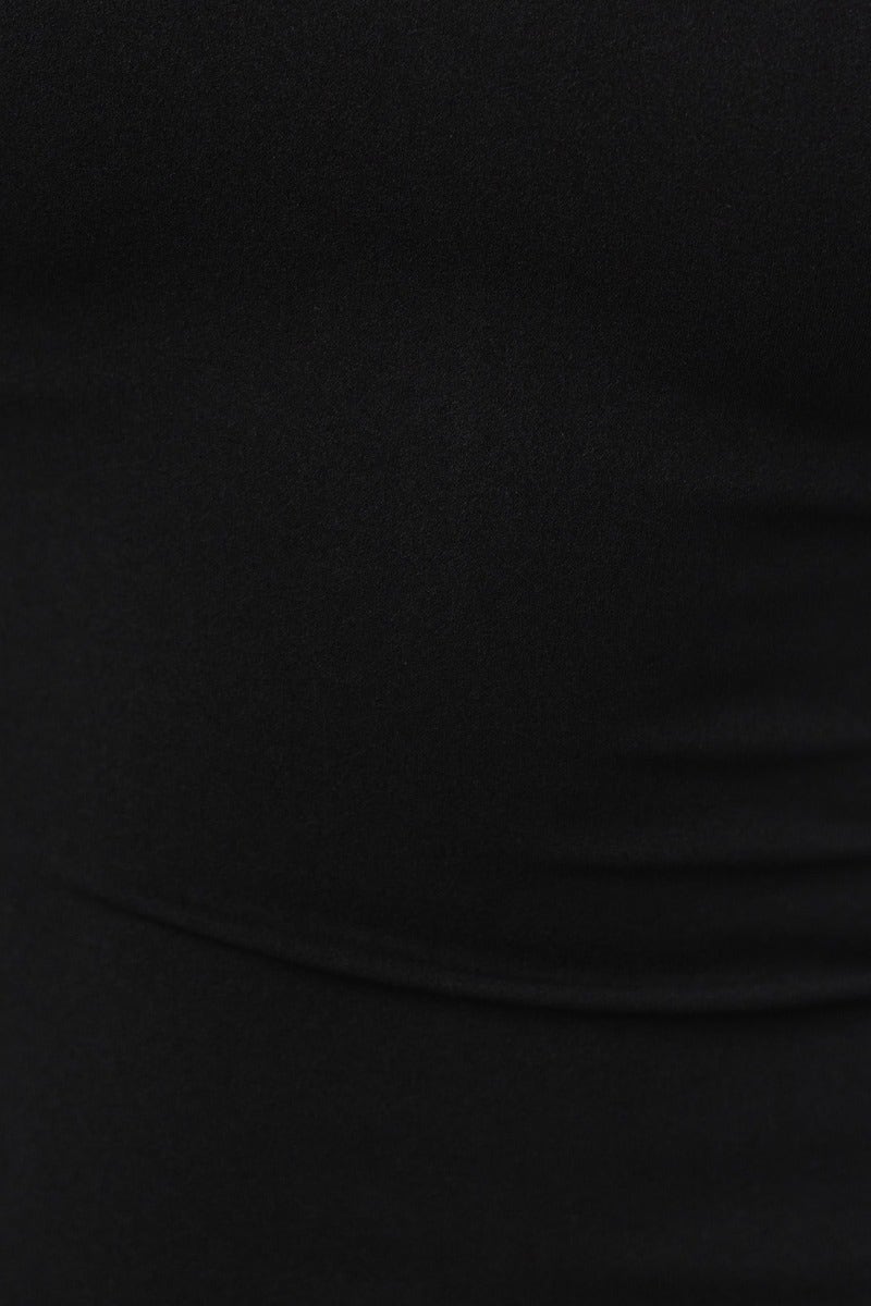Close-up of the black crepe material of the Robbie Maxi Dress, showcasing its stretch and smooth texture.