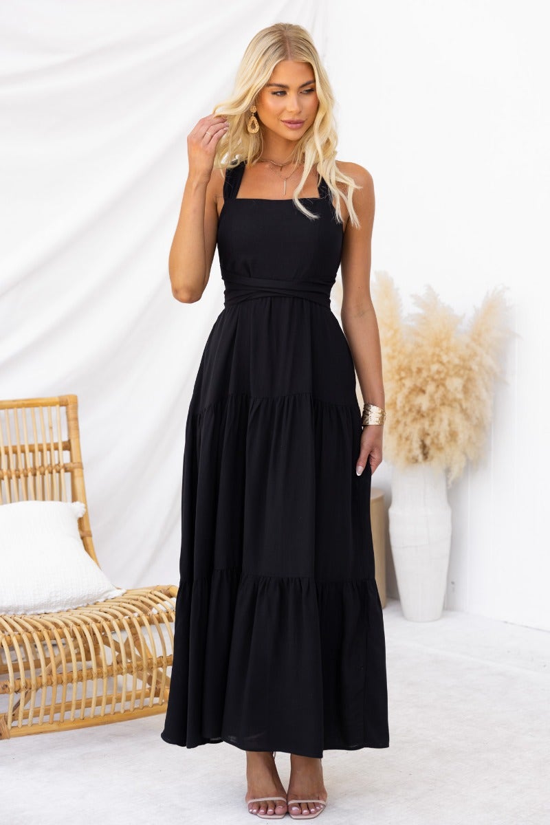 Elegant black Etsie maxi dress with adjustable halter neckline and tiered skirt, perfect for summer outings.