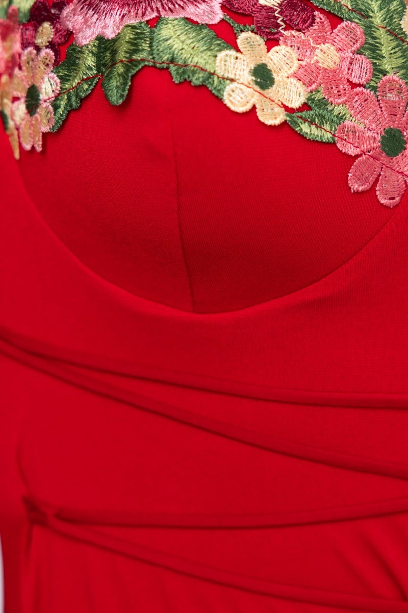 Close-up of the floral embroidered trim and padded bust on the Eyes On Me Maxi Dress in vibrant red.