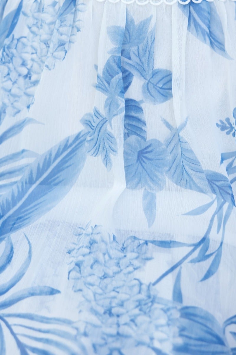 Light blue floral print design on chiffon fabric, showcasing delicate flowers and leaves, perfect for a midi dress.