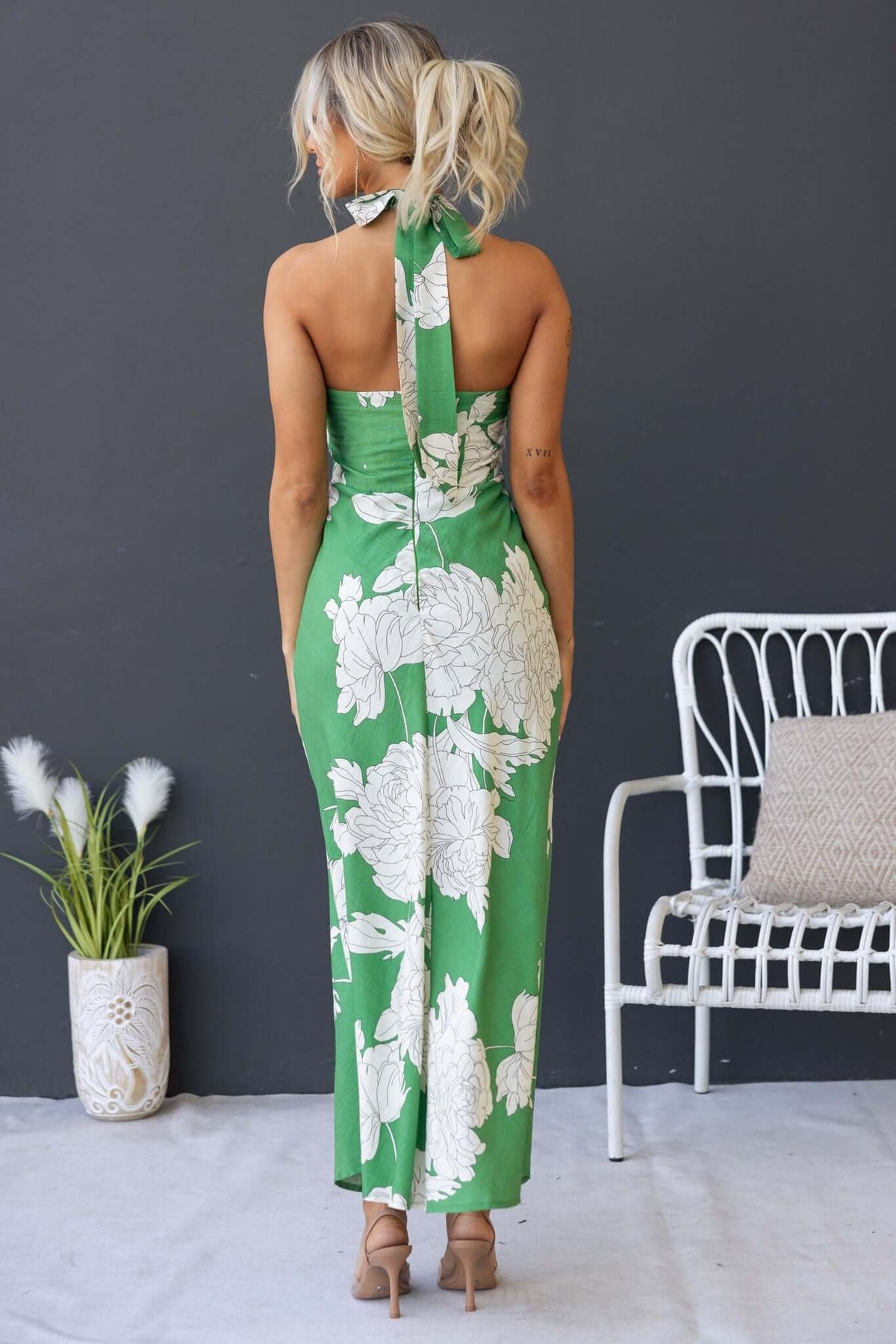 Back view of the Forbidden Love Maxi Dress with a high tie neckline and floral pattern, perfect for elegant occasions.