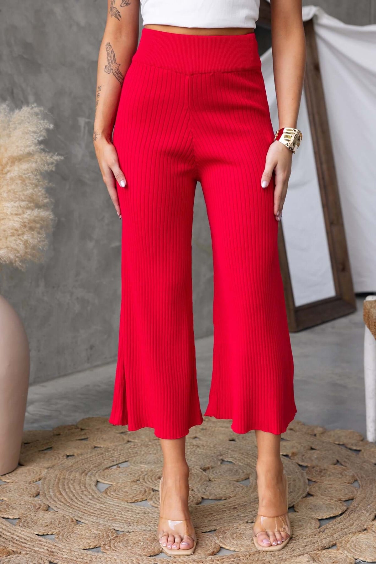 Dipsie Pants in vibrant red, mid-high waist with elastic waistband and ribbed knit material, perfect for a stylish fit.
