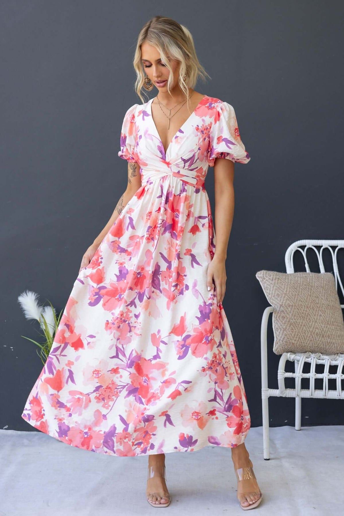 Tinsley Maxi Dress featuring a floral pattern, V-neckline, and short sleeves, perfect for summer occasions.