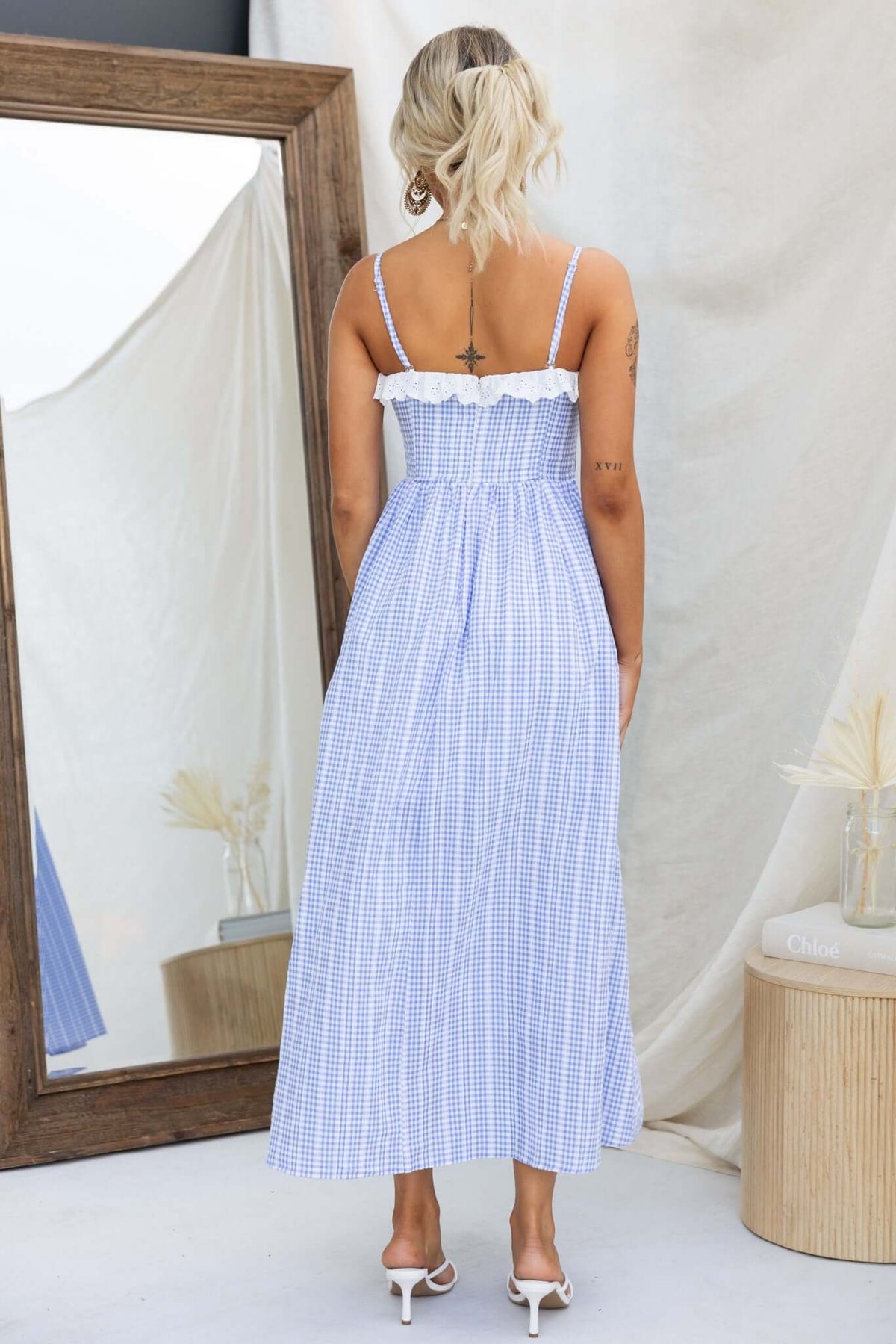 Back view of the Endlessly Maxi Dress featuring adjustable straps and a gingham pattern, perfect for summer occasions.