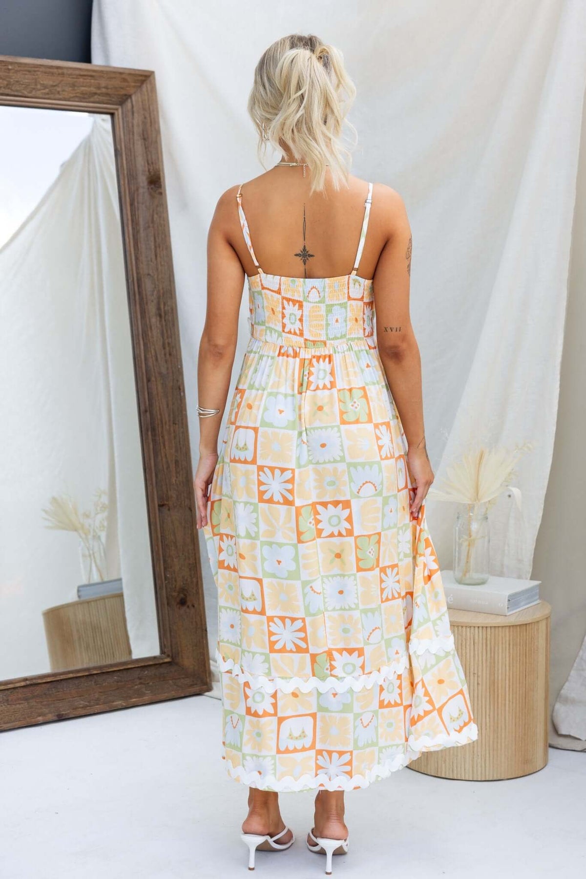Back view of Nekoda Midi Dress with adjustable straps and floral pattern, perfect for summer wear.