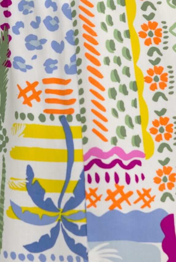 Colorful fabric design featuring patterns in purple, orange, green, and blue shades for the Junia Set.
