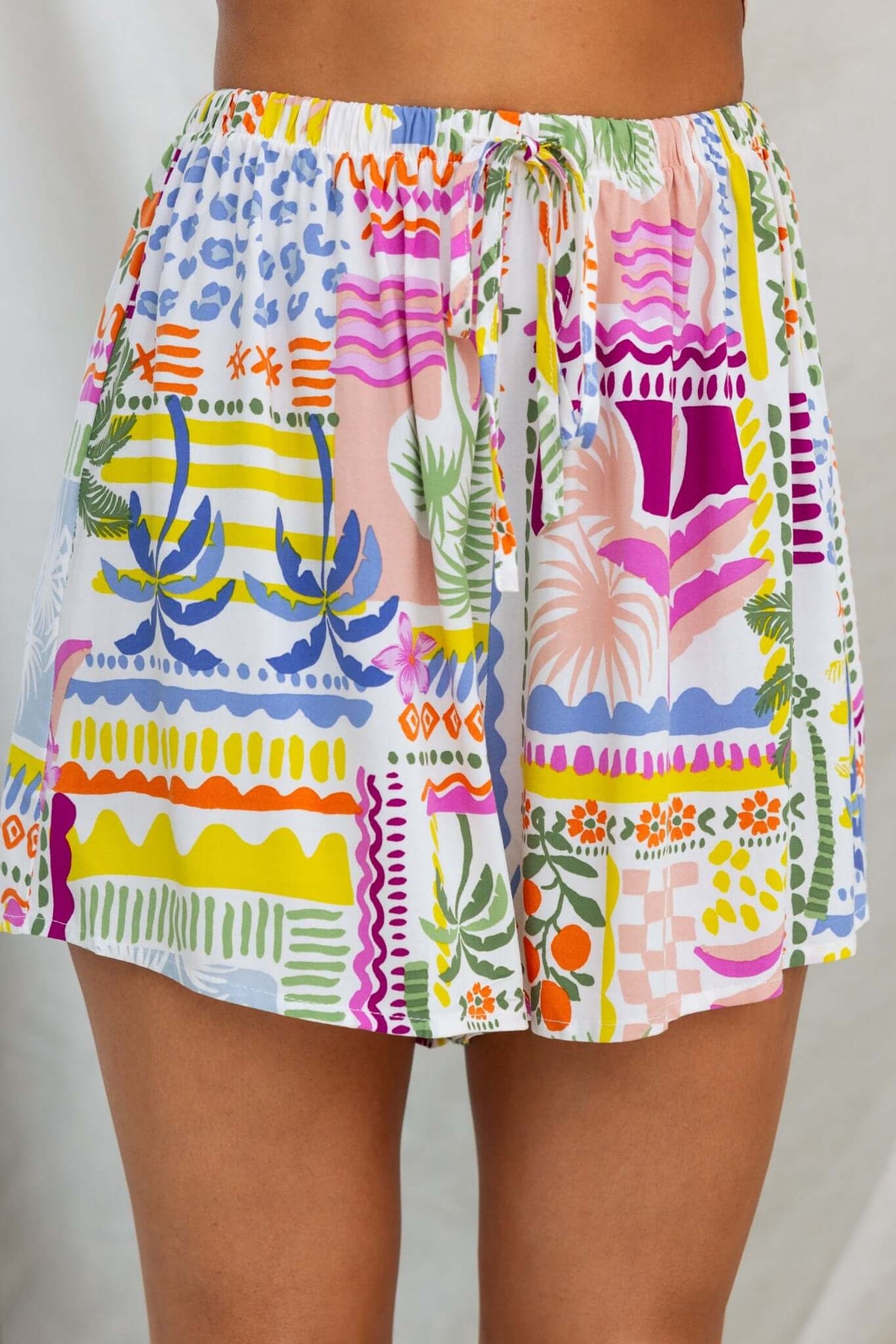 Colorful patterned shorts with a drawstring waist, perfect for summer wear and casual outings.