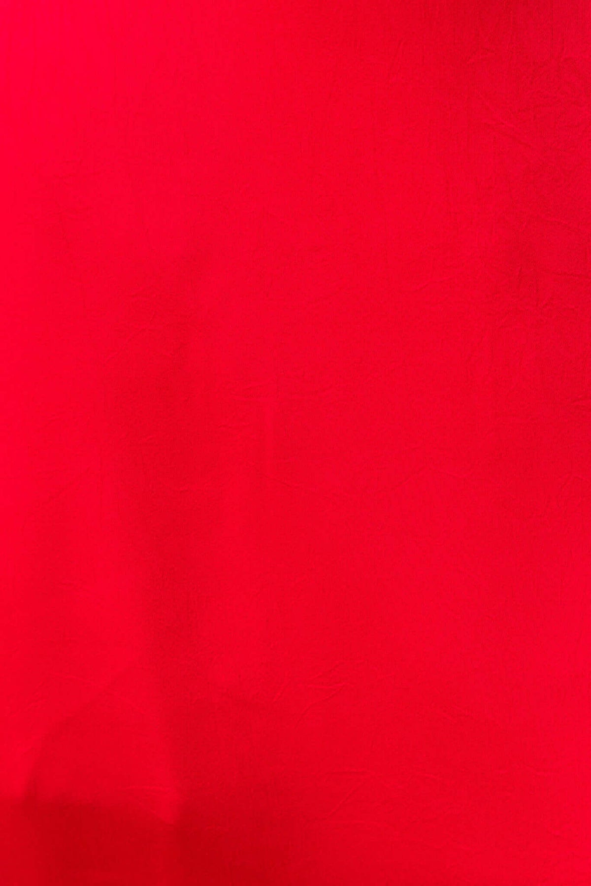 Bright red fabric texture, ideal for creating striking and vibrant clothing items like dresses.