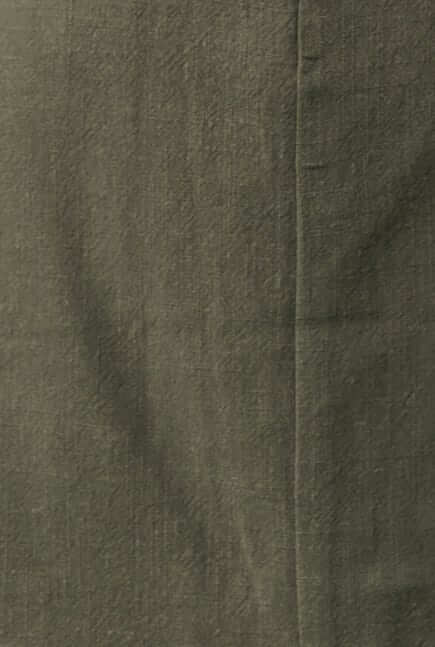 Close-up of textured olive green fabric, showcasing linen blend for Invo Skirt.
