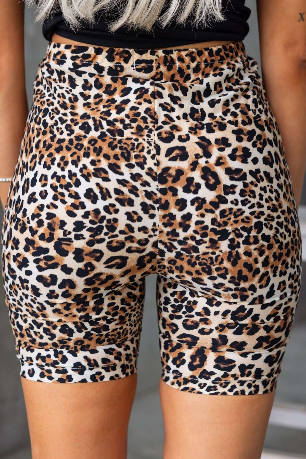 Back view of Boise shorts with leopard print, featuring a mid-high waist and elastic waistband for comfort.