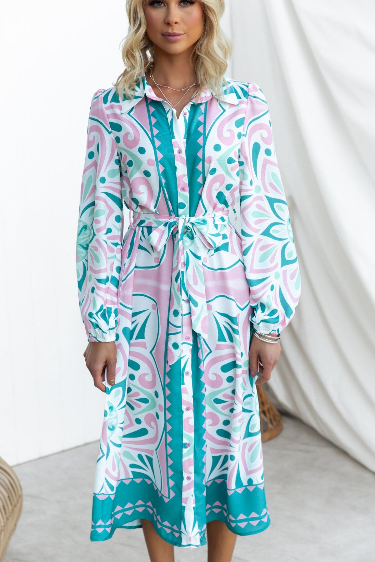 Elegant Faenza Midi Dress featuring a collar, button-front, and floral pattern, perfect for stylish occasions.
