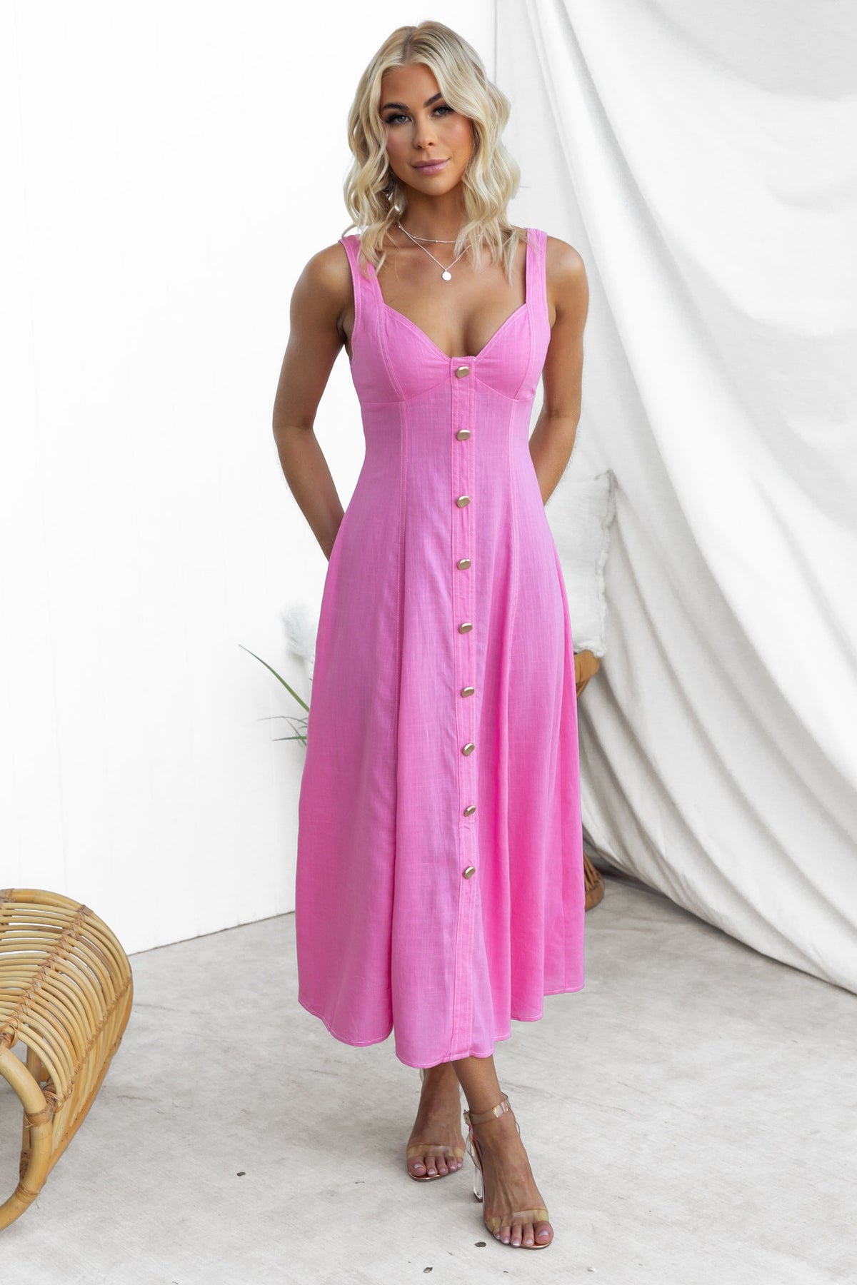 Lyre Midi Dress in vibrant pink, featuring faux buttons, elastic back, and a flattering fit, perfect for summer occasions.